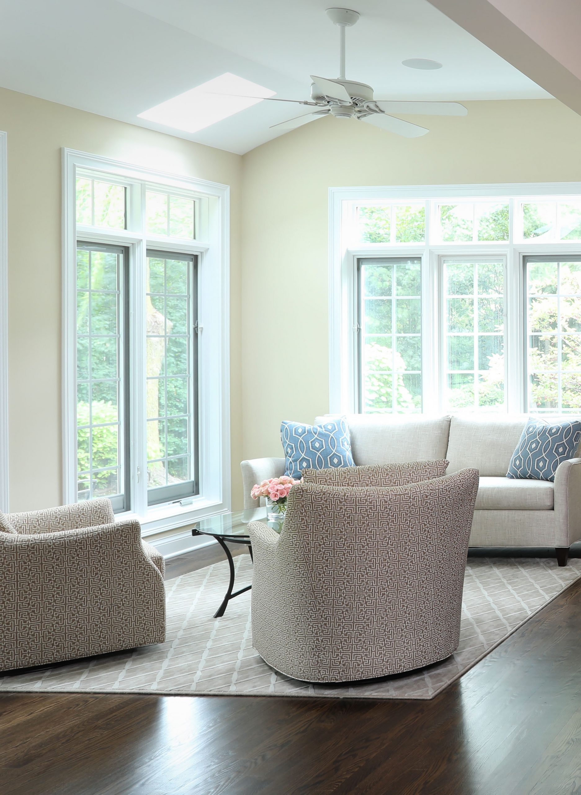 Bright sitting room with windows and skylights