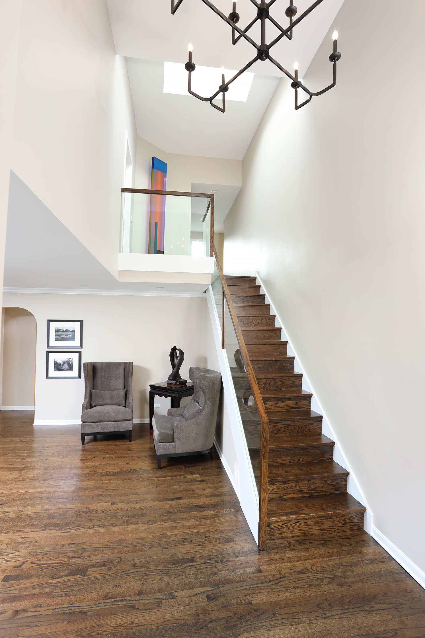 Staircase with wood and glass railing