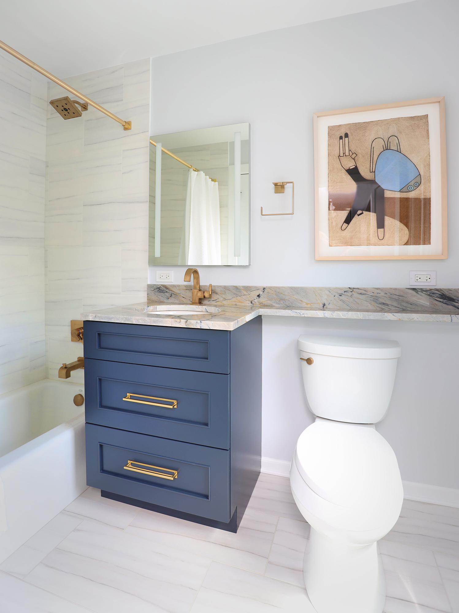 Bathroom with banjo countertop, blue vanity, and gold accents