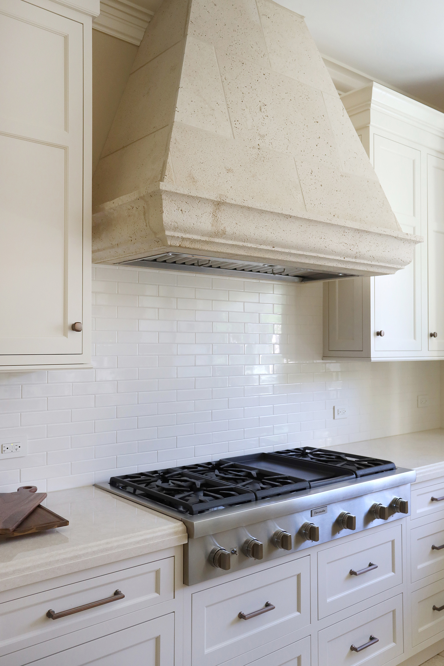 Stone hood over a cooktop