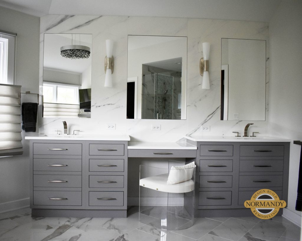 Gray vanity with drawers and doors and makeup table