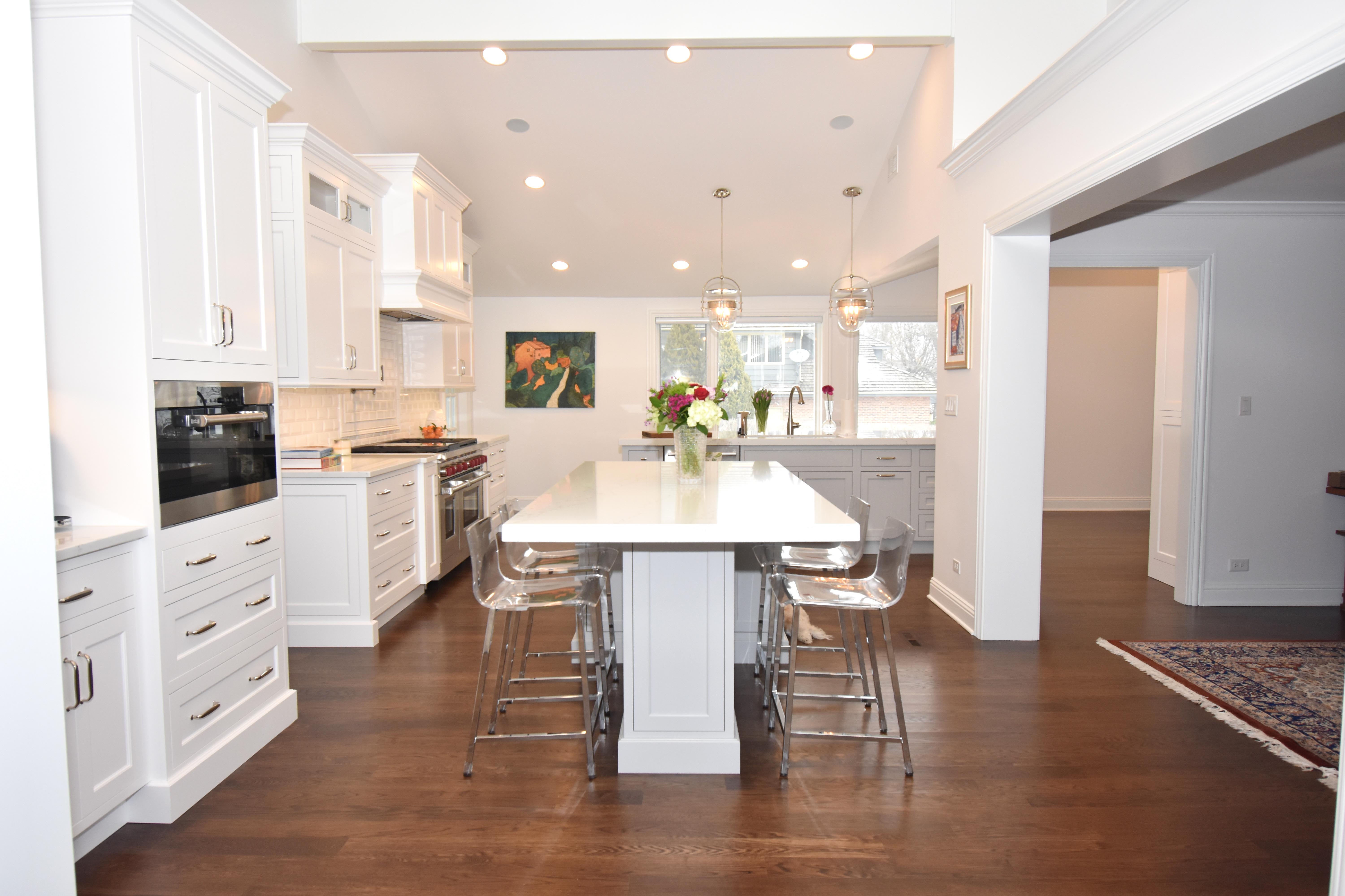 white painted kitchen with 2 islands