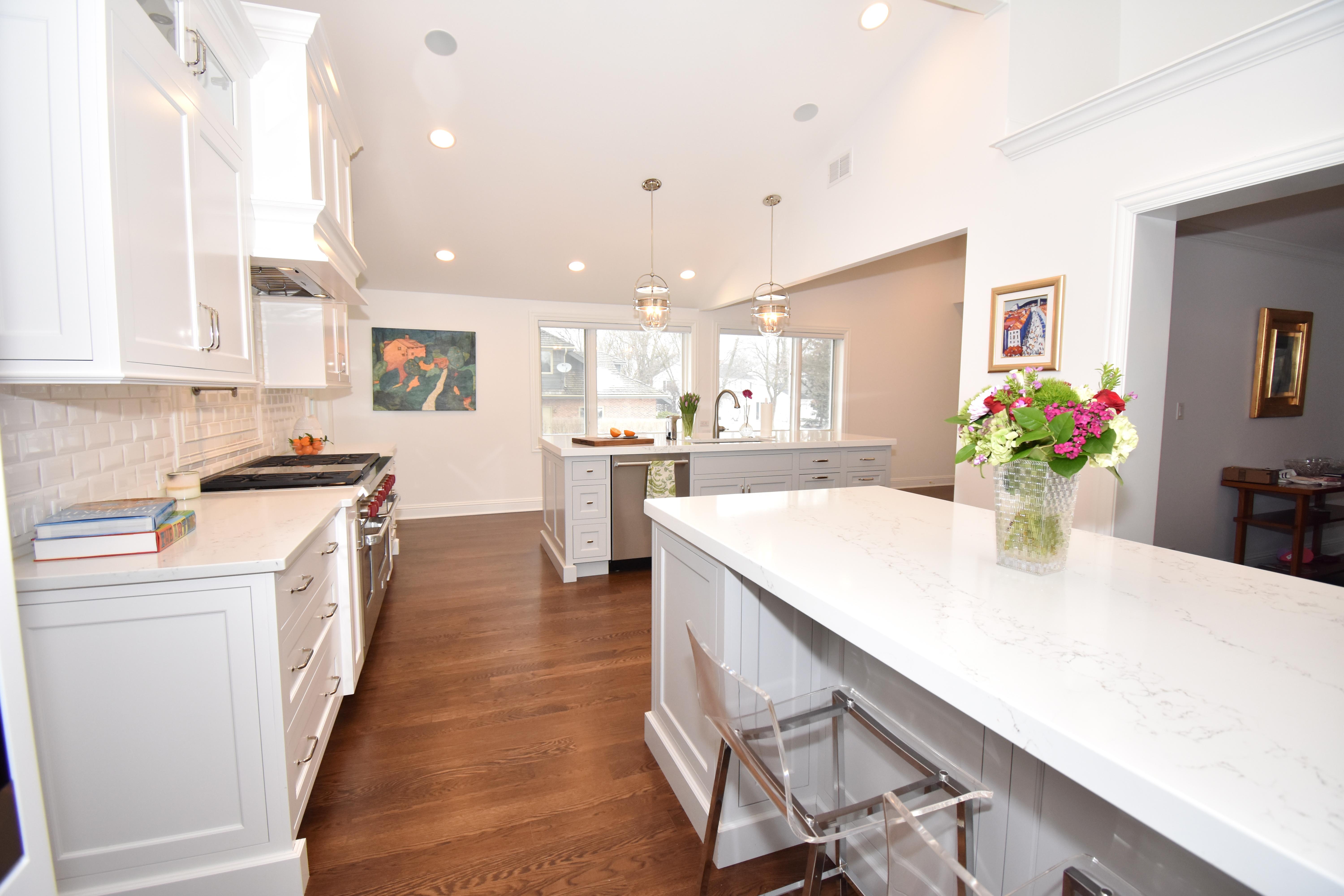 two islands in a white painted kitchen