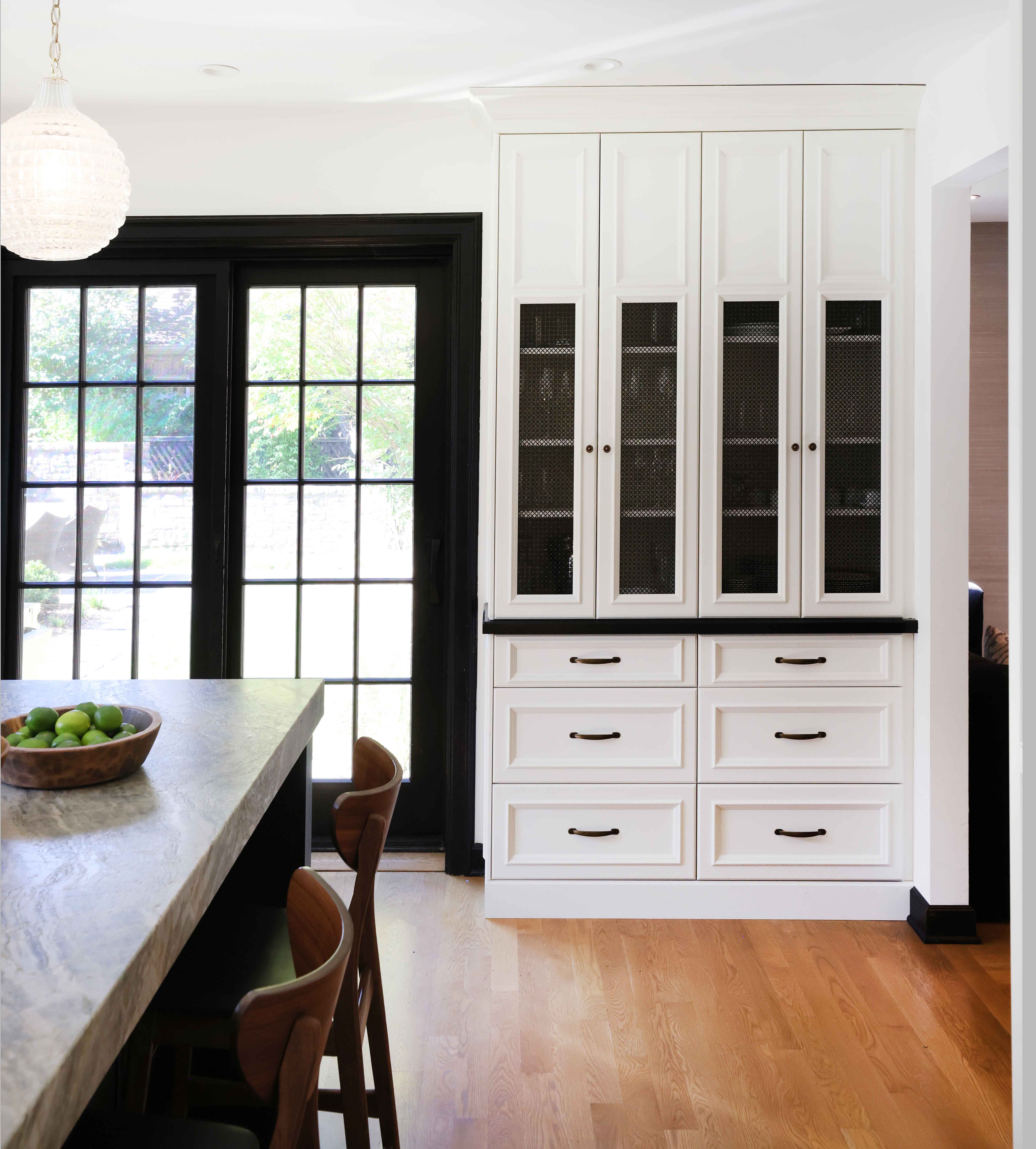 White and black kitchen with mesh insert details