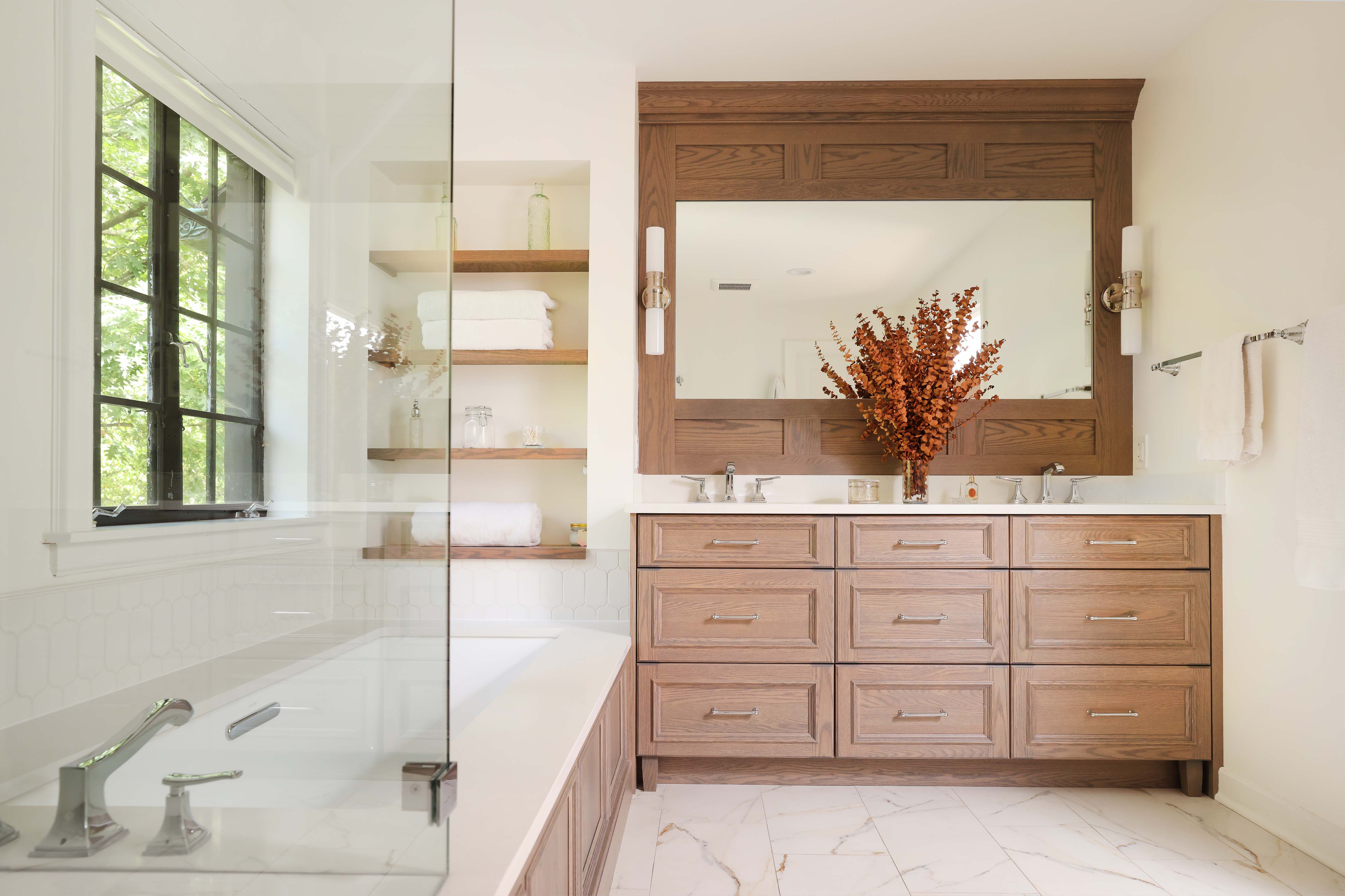 Oak vanity in a primary bathroom