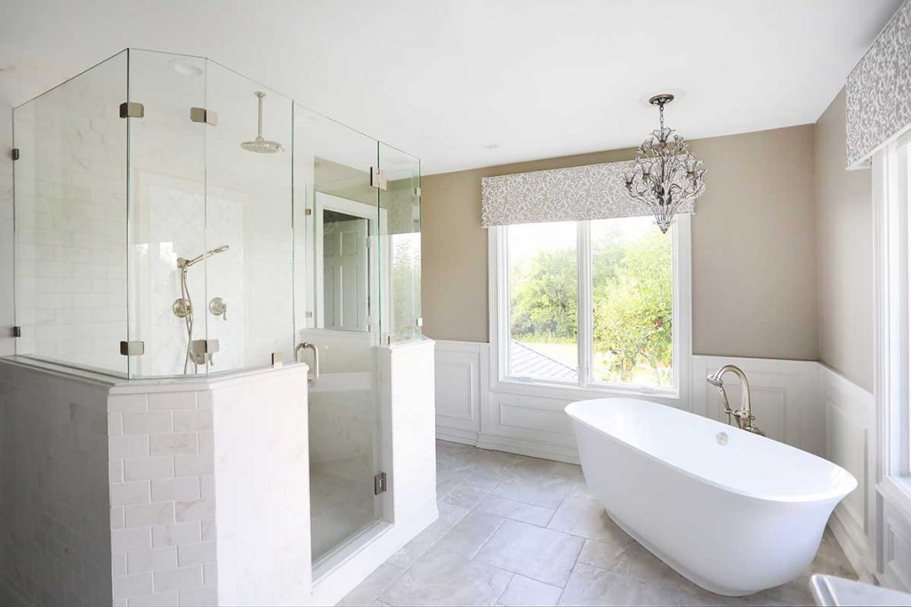 walk in shower, free standing tub, chandelier in master bathroom