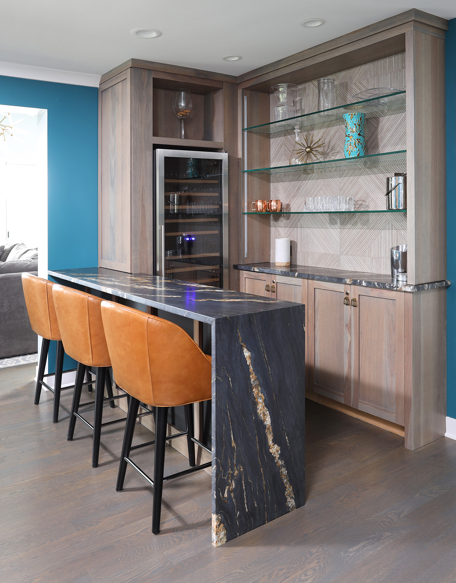 Home bar with black and gold waterfall edge countertop