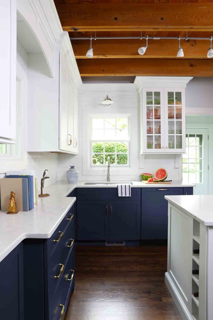 Modern Rustic kitchen, white center island, blue lower cabinets, exposed beams, mullion cabinets