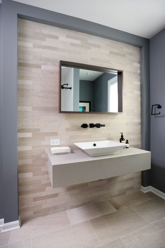 Tile accent walls and matte black fixtures are among top bathroom remodeling trends for 2023