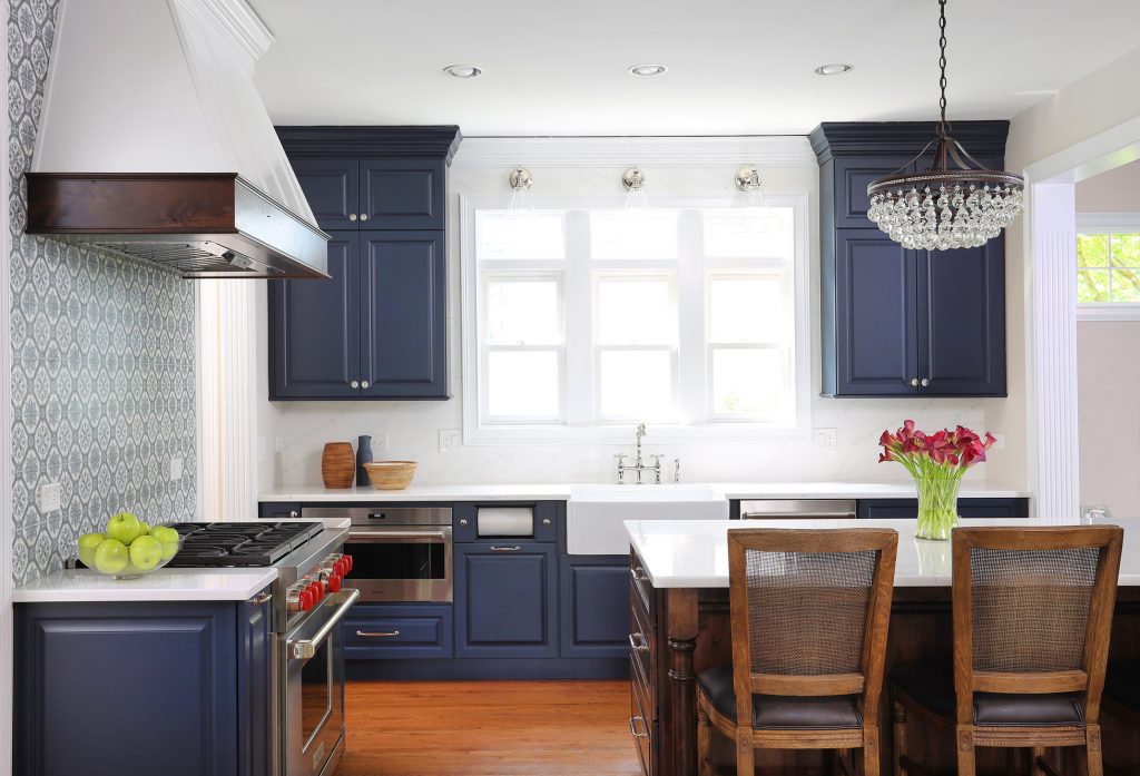 Blue and white kitchen with stained Alder island