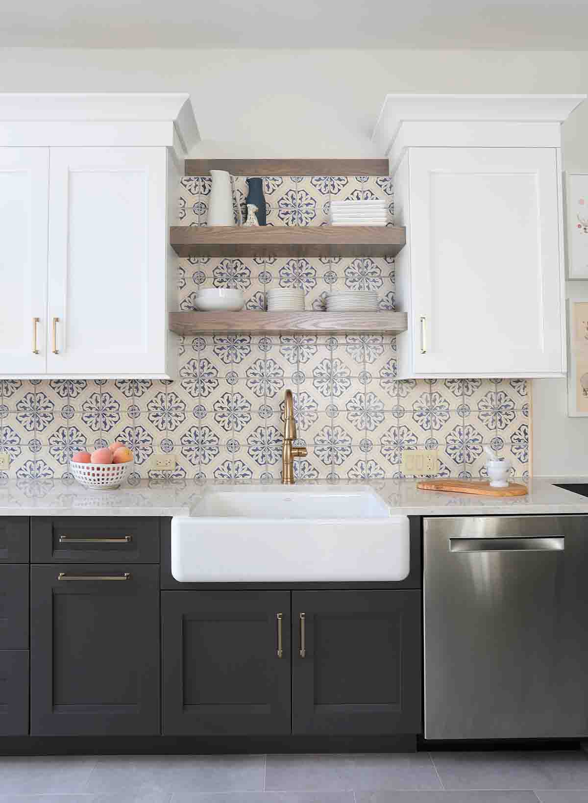 blue decorative backsplash tile open shelving and apron front sink