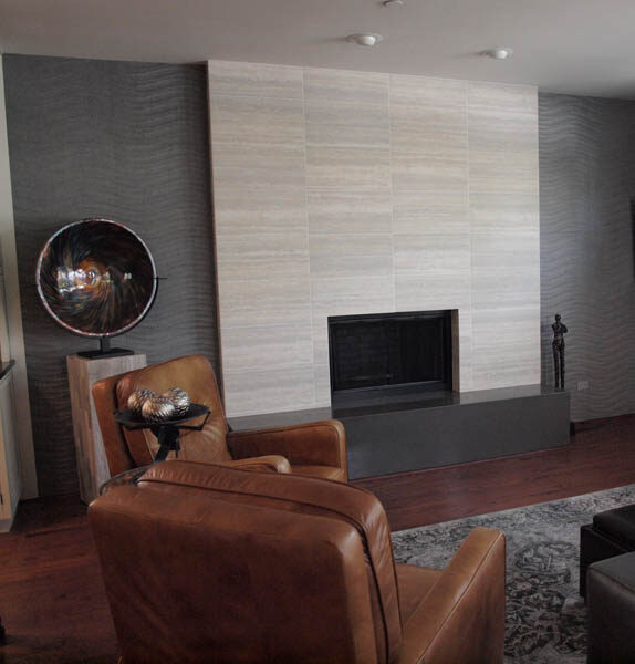 tile accent wall with tile fireplace in living room