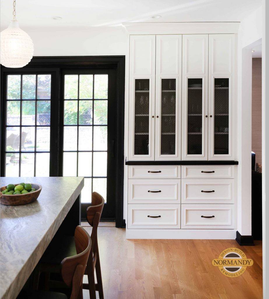 White and black kitchen with mesh insert details