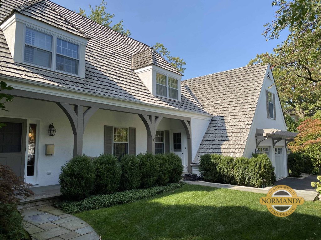 Stucco home with shake roof