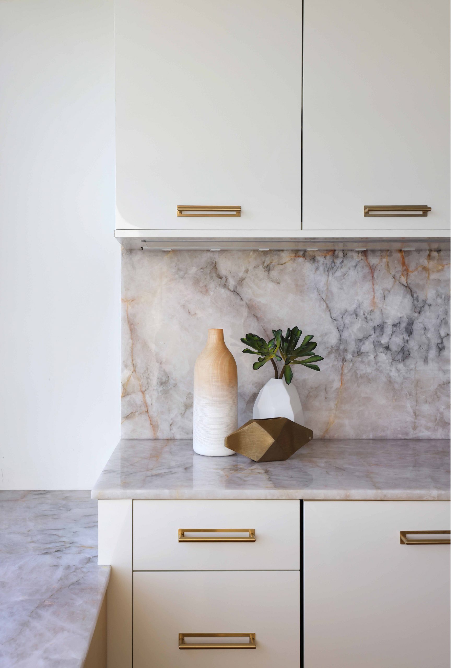 slab backsplash in a high gloss chic kitchen