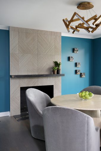 Fireplace with geometric shaped textured porcelain tile