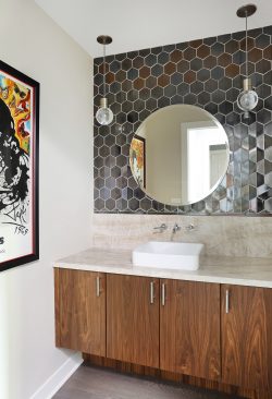 Modern powder room with hexagon tiles, vessel sink, and floating vanity