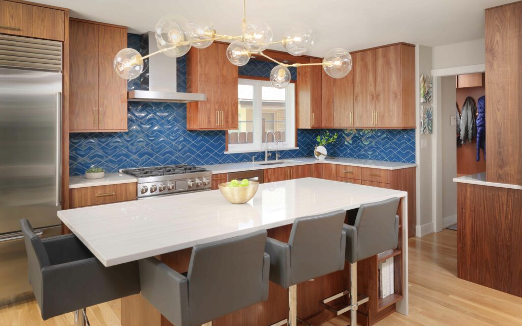 midcentury modern kitchen with waterfall edge island and blue backsplash tile