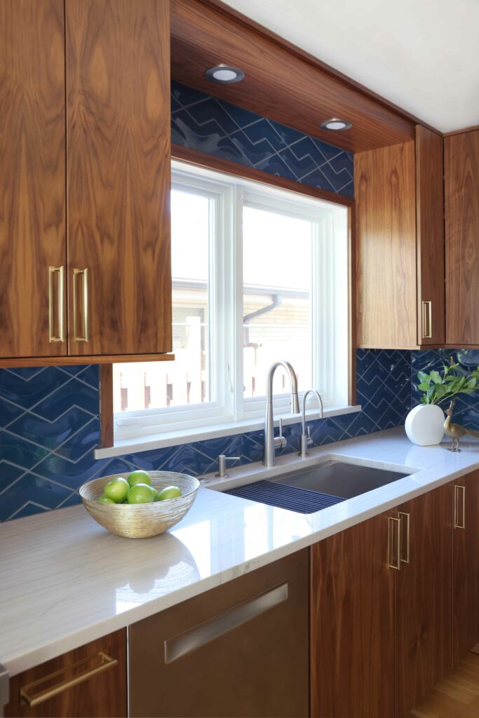 stained modern kitchen cabinets with blue backsplash