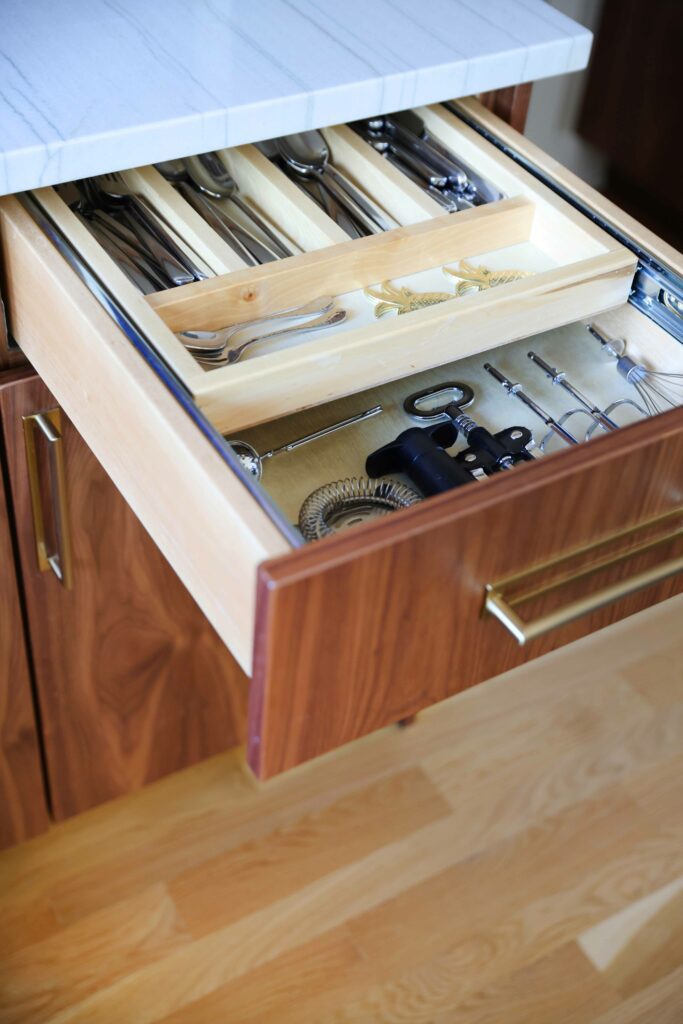 utensil divider drawer in Mid Century modern kitchen with walnut cabinets