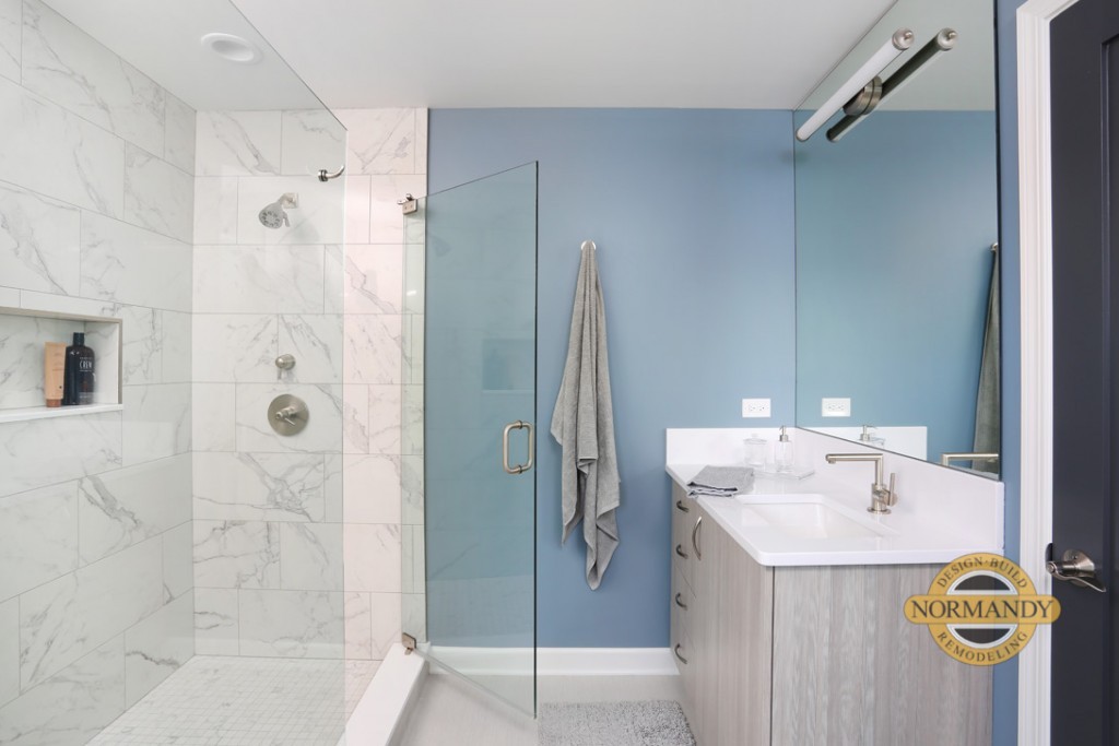 master bathroom with two vanities and oversized luxury shower