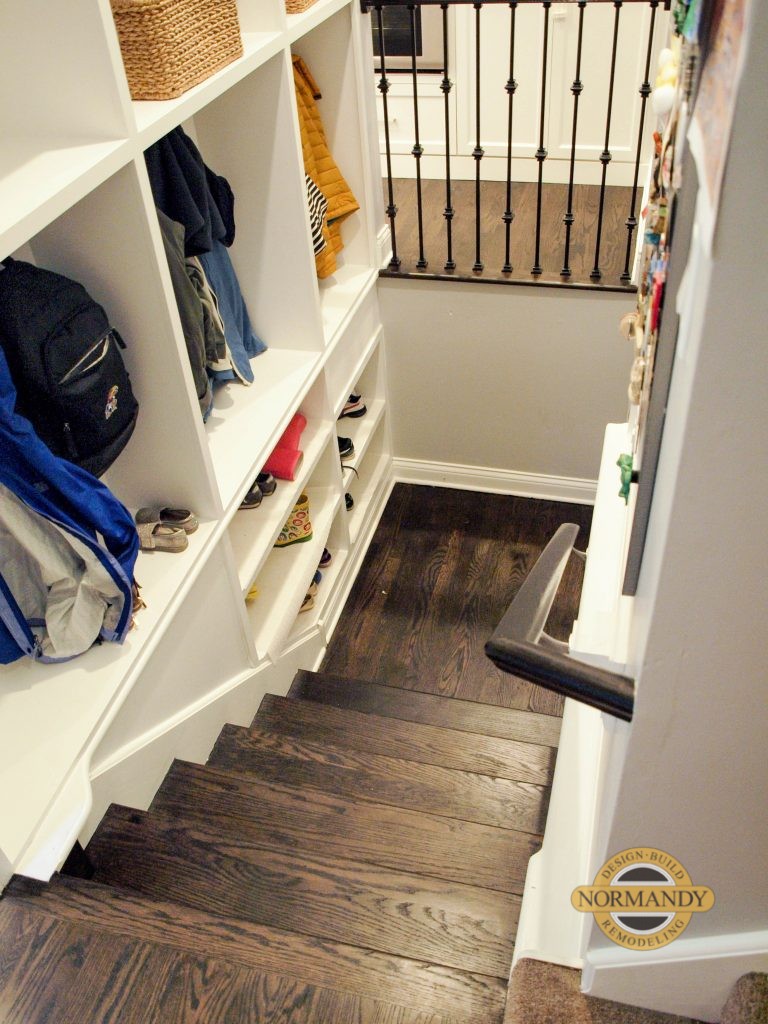 mudroom cubbies along stairs to the basement