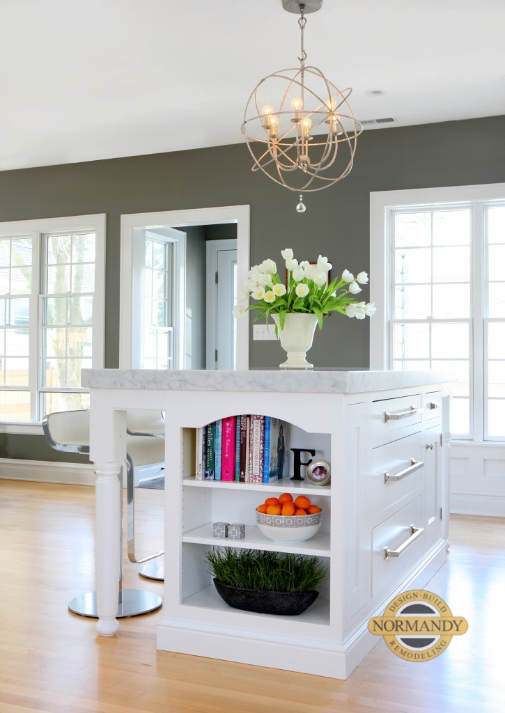 book shelves at the end of a kitchen island