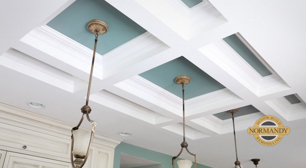 coffered ceiling beams with blue paint and pendant lights