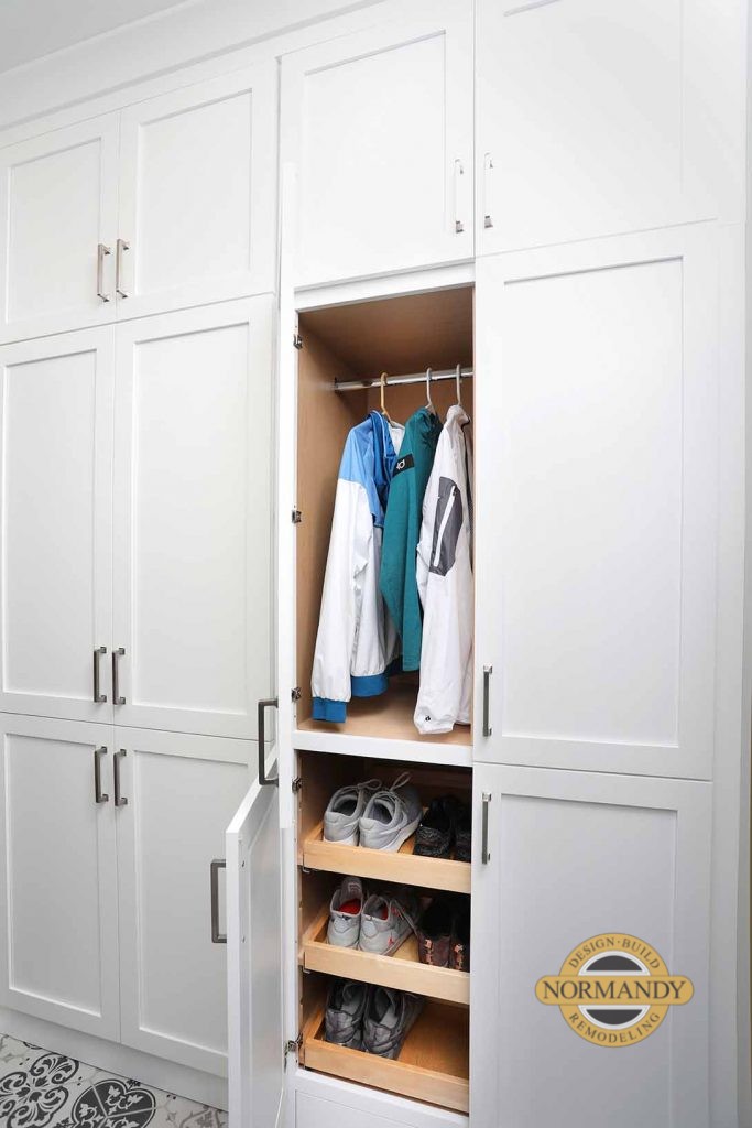 Hidden mudroom storage in the laundry room