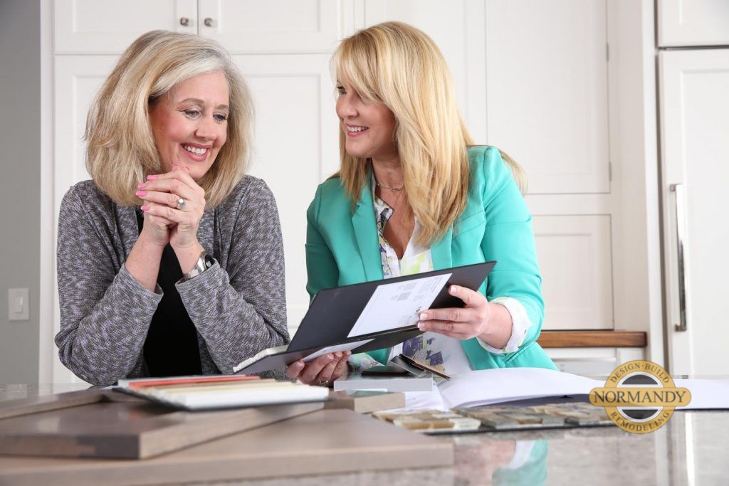 Woman looking at design ideas with her designer