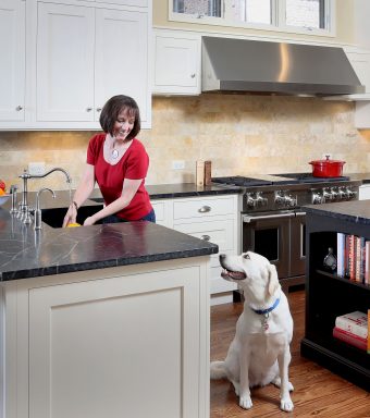 Woman and dog in kitchen