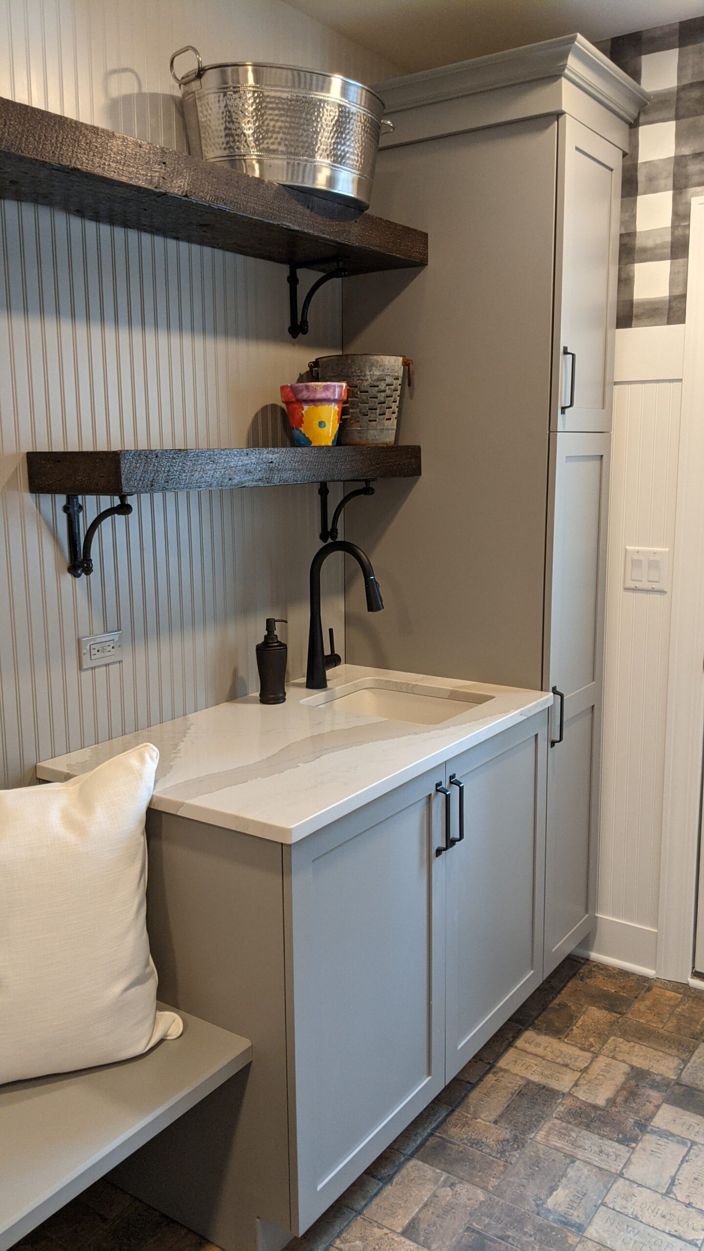 reclaimed barn wood open shelving in mudroom with gray walls