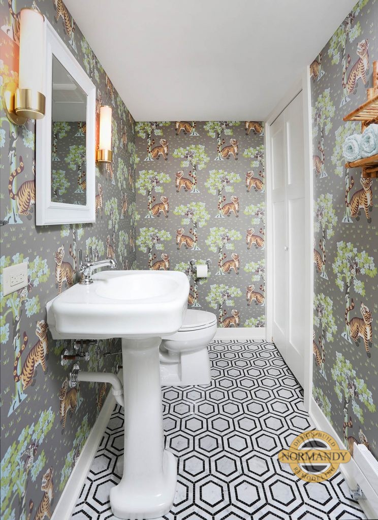 Basement powder room with bold wallpaper