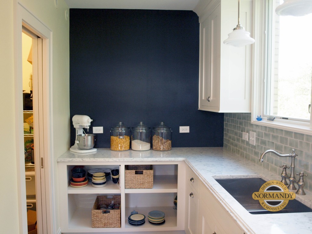 kitchen sink with open shelving nearby