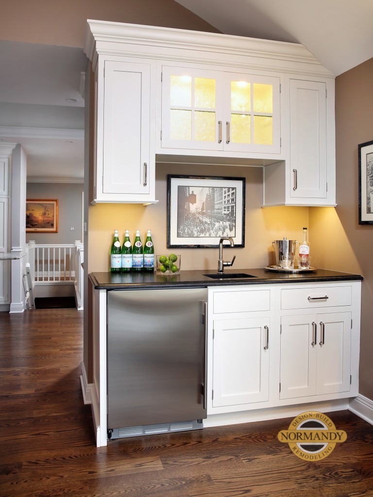 Wet bar in living room that coordinates with kitchen