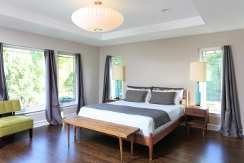 Master Bathroom with freestanding tub in front of large windows