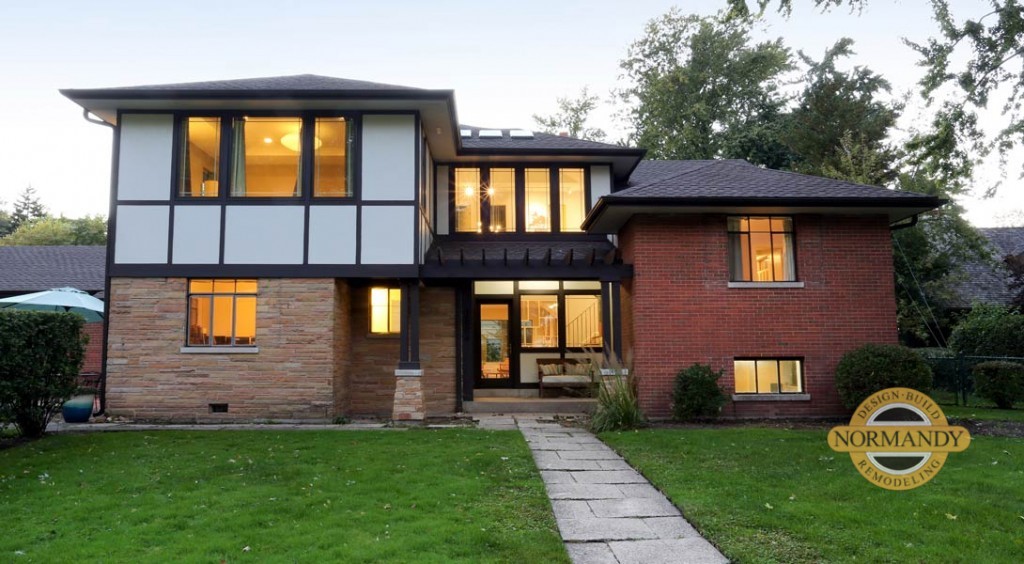 Master suite addition with a modern take on a Tudor style home