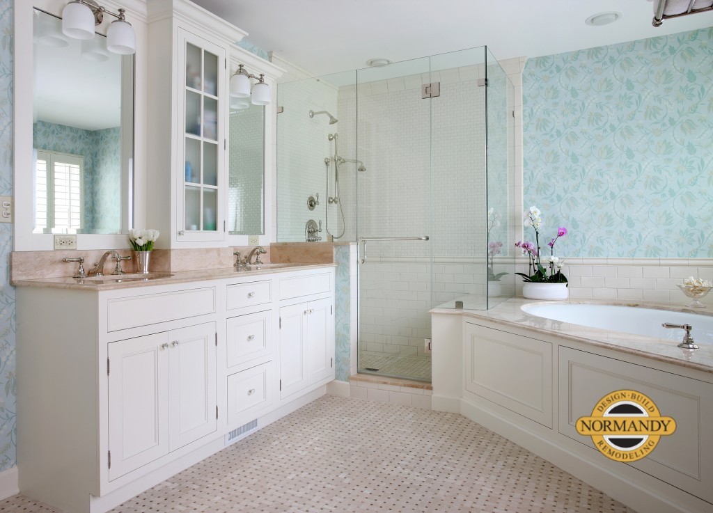 Traditional style primary bathroom with white painted cabinets