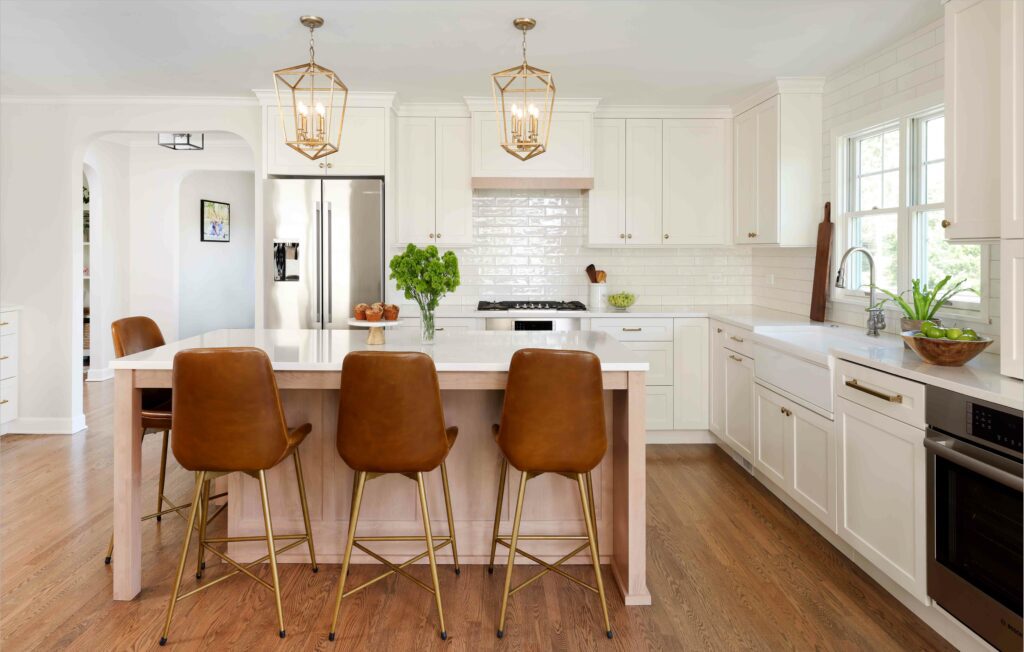 White shaker style kitchen with stained wood island