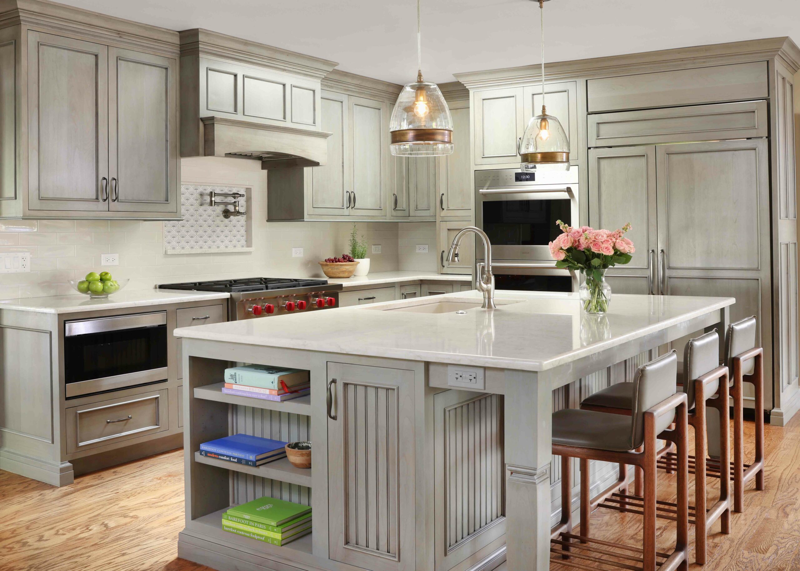 transitional kitchen island sink with bead board and storage