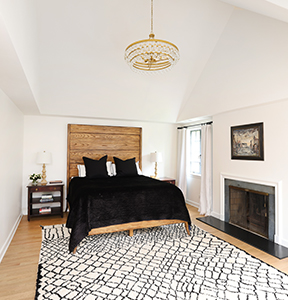 Primary suite with tray ceilings and fireplace