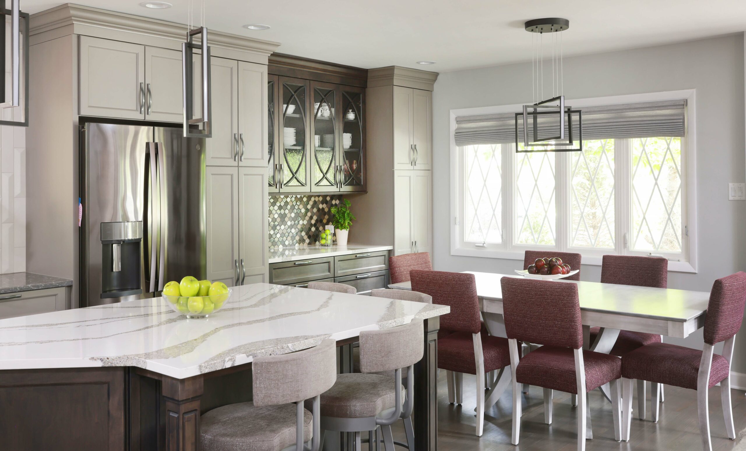 gray kitchen with island, built-in buffet and kitchen table