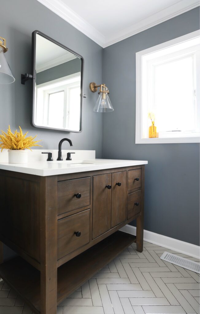 rustic powder room vanity with herringbone floor tile