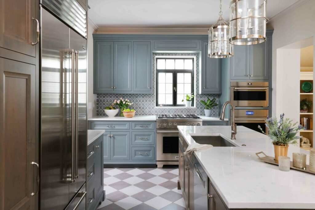 Vintage inspired kitchen with checkboard floor, gray painted cabinets and stained wood cabinets