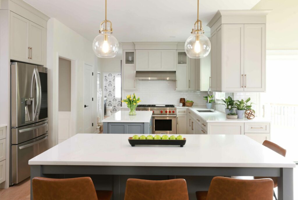 White kitchen with two islands perpendicular to each other