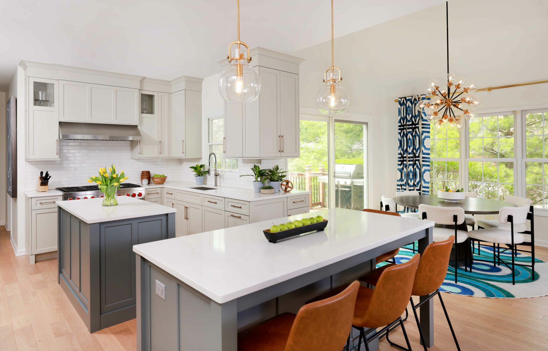 Warm White Kitchen with Two Gray Islands