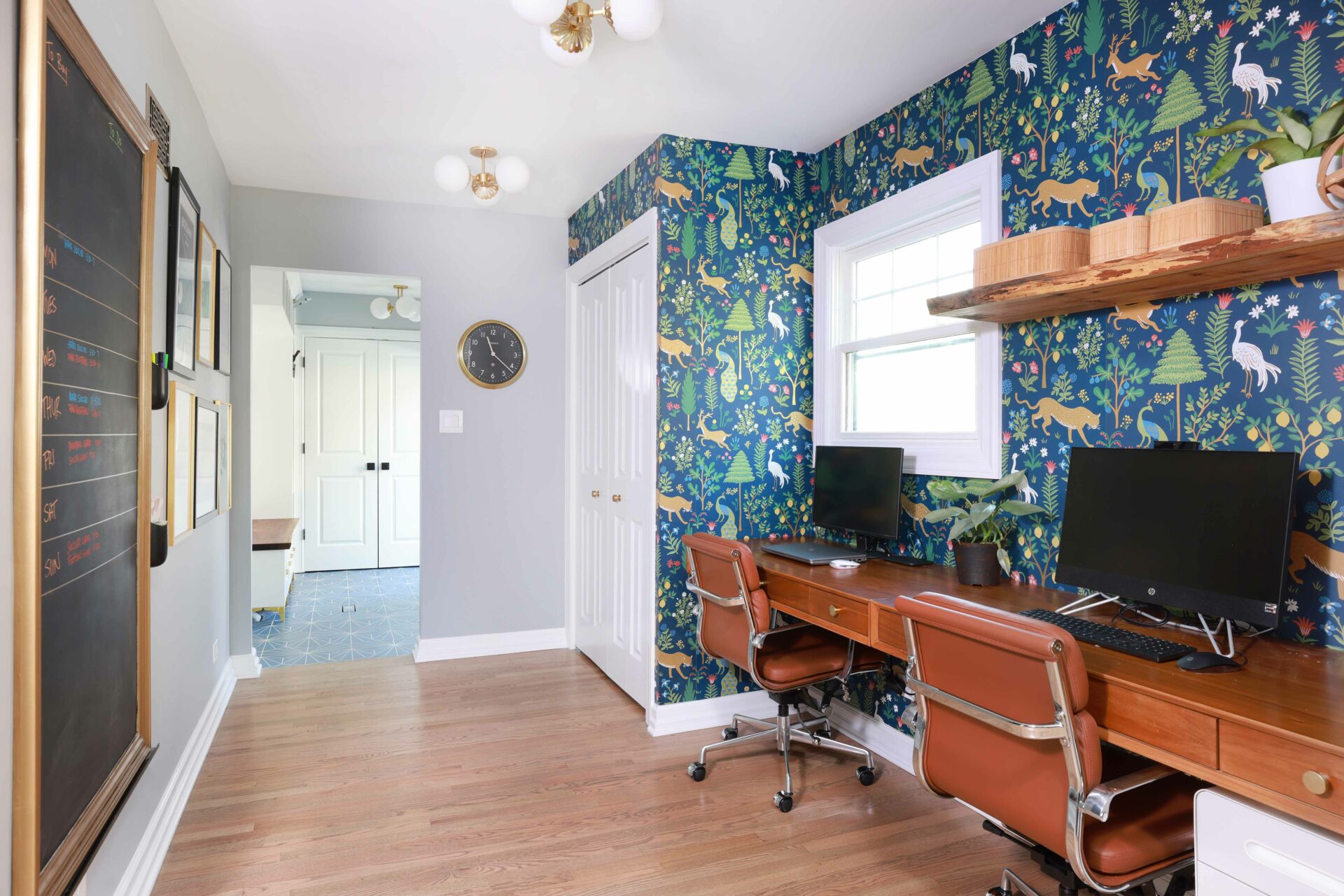 Two side by side home office spaces in a wide hallway