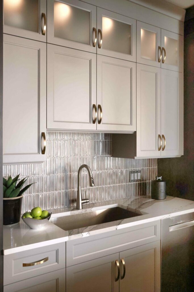 Chicago condo kitchen with glass tile backsplash and quartz countertop