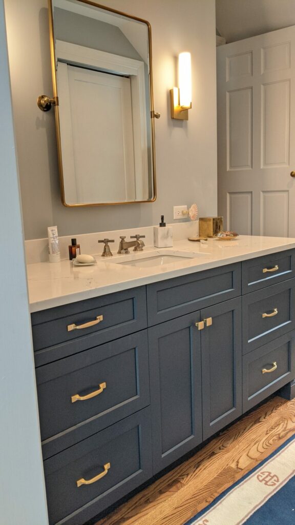 matching navy vanity in adjacent dressing room