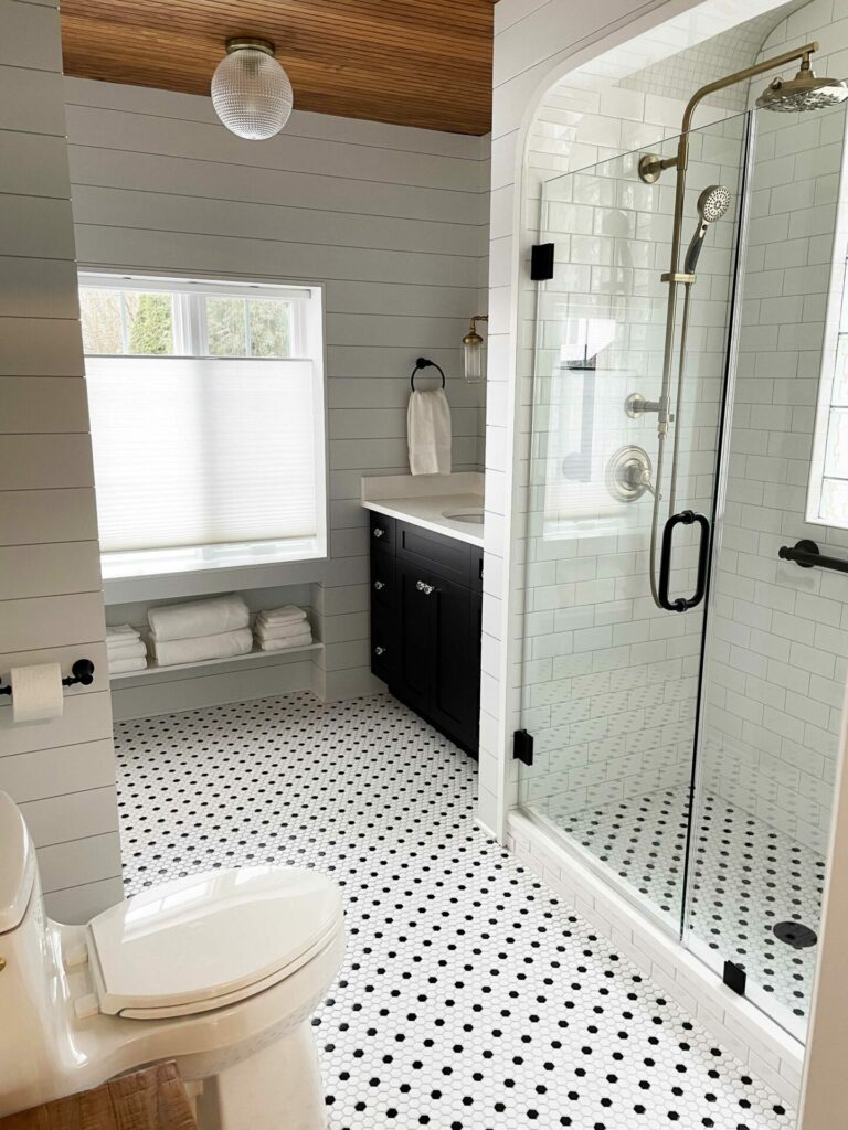 vintage black and white bathroom with wood ceiling